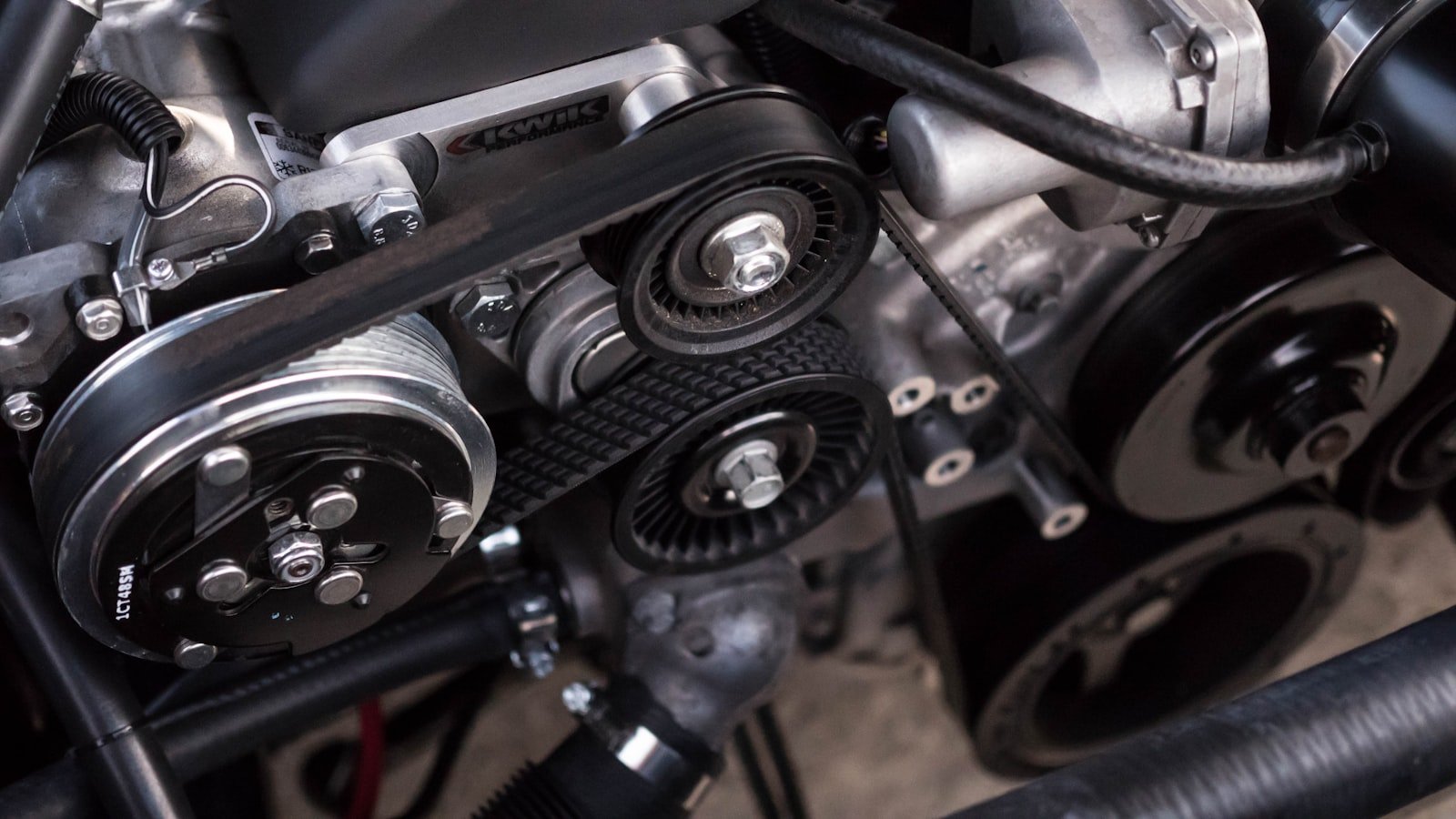 Diesel engine belts and pulleys during tractor repair at Quality Truck Repair Inc. in Bloomington, CA