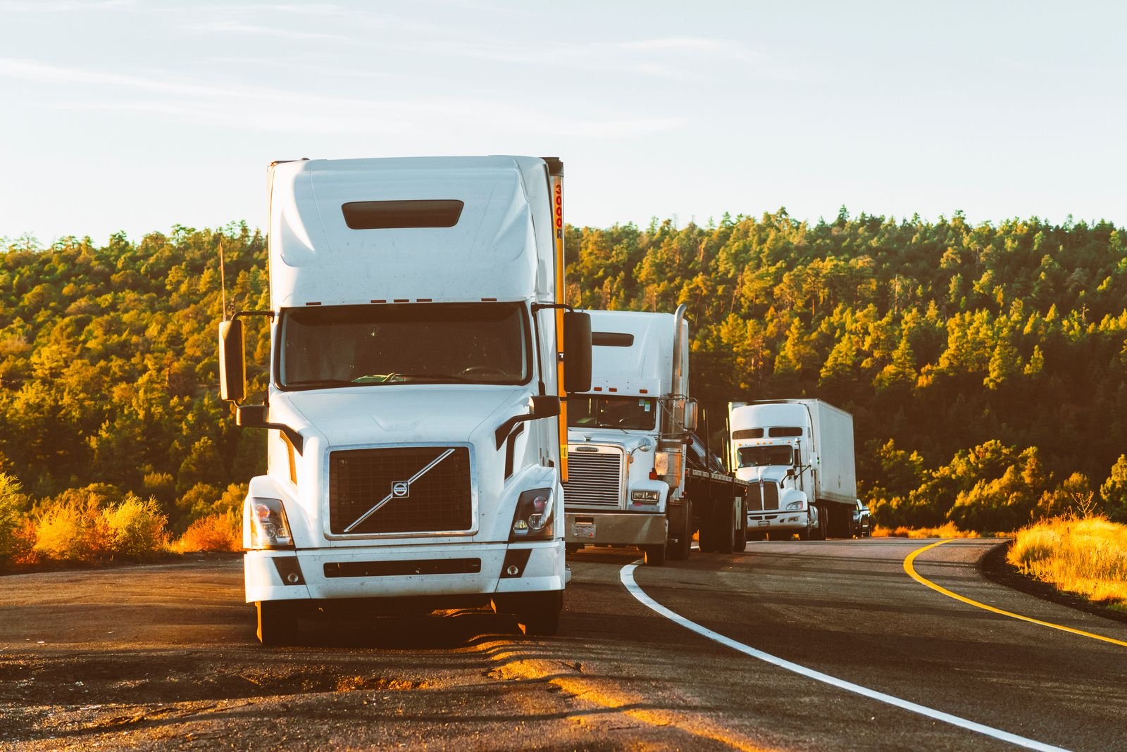 Semi-trucks running strong on the highway after diesel engine repair by Quality Truck Repair Inc. in Bloomington, CA